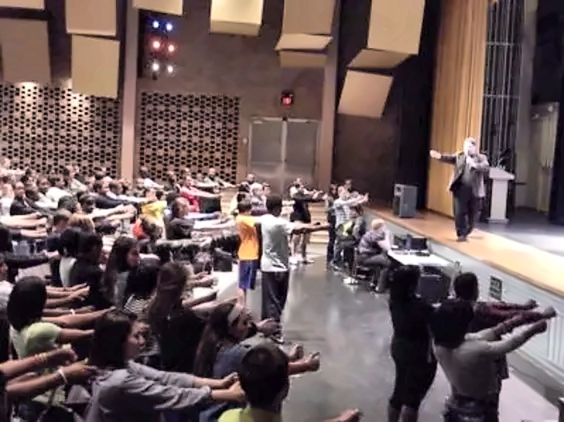 Corporate hypnotist Michael Oddo leading an interactive team building entertainment show
